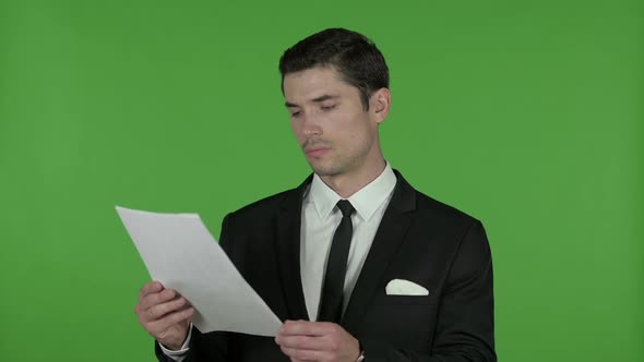 Ambitious Young Businessman Reading Documents Chroma Key