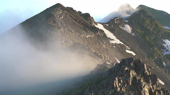 Condensation of Moist Air on Top of the Mountain