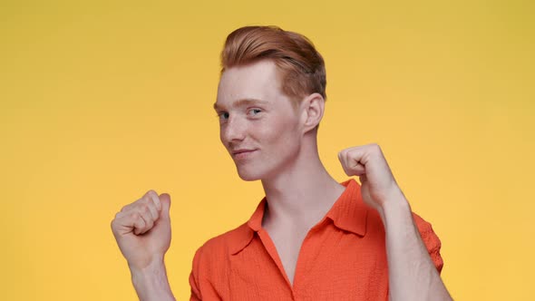 Confident Caucasian Guy with Red Hair Showing Thumbs Up