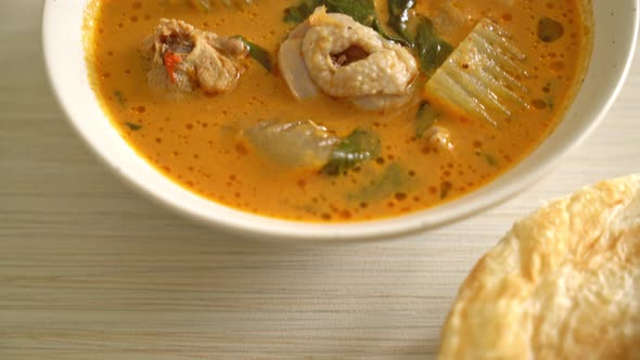 Chicken curry soup with roti or naan with chicken tikka masala - Asian food style