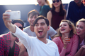 Cheerful young man making a selfie with his friends - PhotoDune Item for Sale