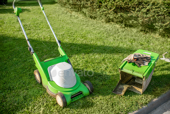 Lownmower on the grass outdooors / Photodune, Misc