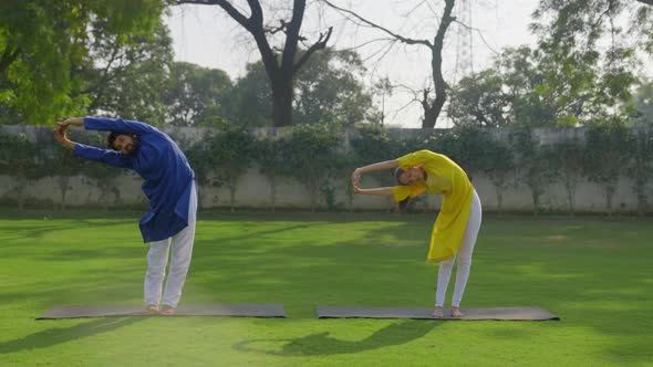 Indian couple doing yoga