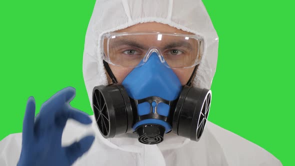 Doctor in Protective Clothing Showing OK Everything Will Be OK on a Green Screen, Chroma Key