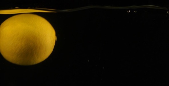 Fresh Lemon Falling in Water Slow Motion