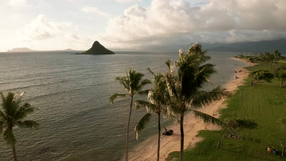 Drone Aerial Rise from shore at Chinaman's Hat. Oahu, Hawaii