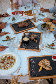 Festive dinner on the table outdoors / Photodune, Misc