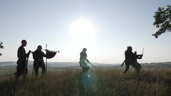 Medieval men training with swords