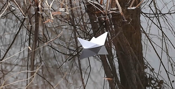 Paper Boat Is Blown Away By The Water