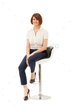 Portrait of smiling businesswoman on chair / Photodune, Misc