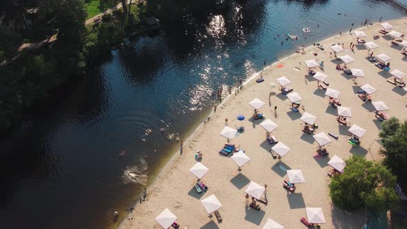 Aerial Top View of River Sand Beach with Lounges and Umbrellas