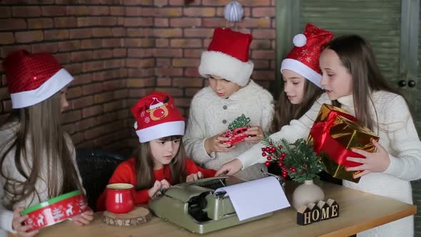 Little children sitting on authentic Santa Claus' knees indoors