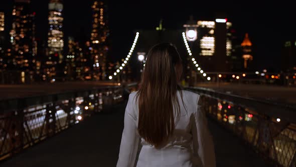 Walking Trough on the Brooklyn Bridge at Night 42