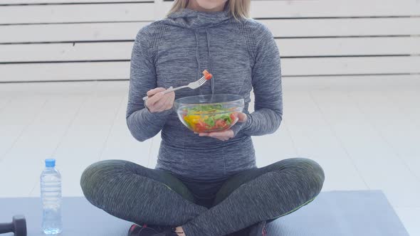 Healthy Eating Concept. Young Fit Woman Eating Healthy Salad After Workout