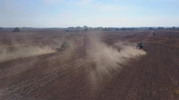 Drone Shooting of Tractors Cultivating Agricultural Land.