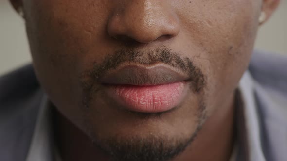 Young Adult Africanamerican Man Smiling on an Extreme Closeup