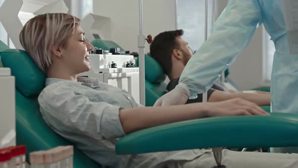 Doctor Preparing Girl for Blood Taking Procedure