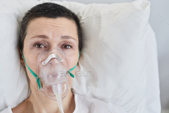 Person in oxygen mask at hospital