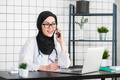 portrait of beautiful muslim female doctor using mobile phone - PhotoDune Item for Sale