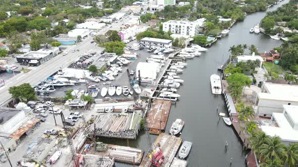 A boat dealer on the Little River in Miami, Florida.  The marina is capable of hauling out large boa