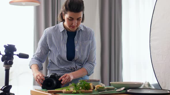 Food Photographer with Camera Working in Kitchen