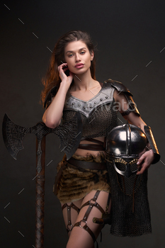 Studio shot of wild woman viking holding axe / Photodune, Misc
