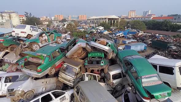 A Stack of Scrapped Cars, Motorcycles and Motor Scooters.