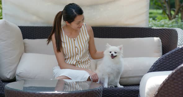 Woman go resort hotel with her dog