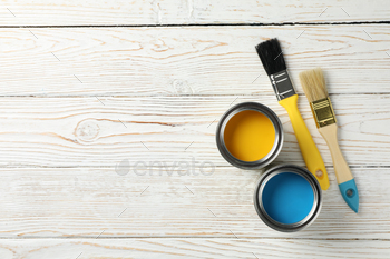 Paint cans and brushes on wooden background, top view / Photodune, Misc