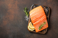 Fresh salmon fillet on wooden board and spices for cooking - PhotoDune Item for Sale