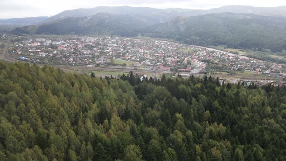 Village in the Carpathian Mountains in Autumn. Slow Motion, Aerial View