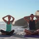 Young Couple Doing Yoga on Beach - VideoHive Item for Sale