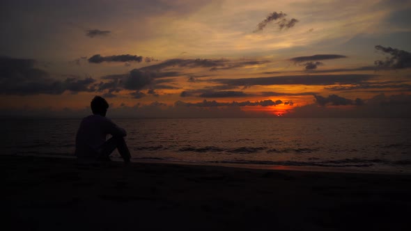 Silhouettes at sunset beach