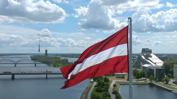 Latvian Flag with the Dome Cathedral and an Old Town in the Background in Riga Latvia