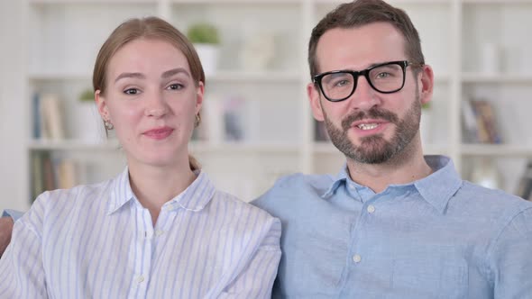 Portrait of Cheerful Young Couple Doing Video Call