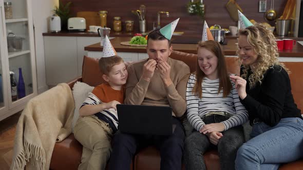 Cheerful Deaf Family During Video Chat at Laptop