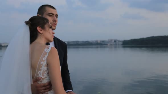 Happy Married Couple in Wedding Day Bride By the Lake