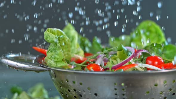 Water Falling to Fresh Salad in Super Slow Motion