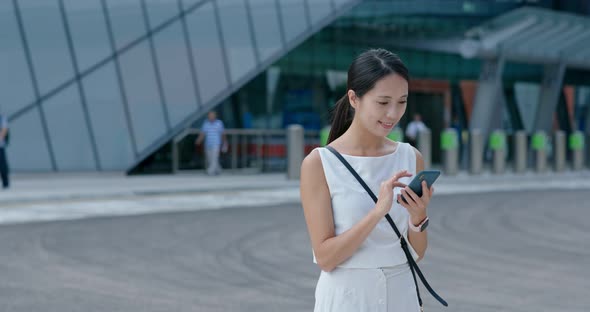 Woman use of smart phone in Hong Kong