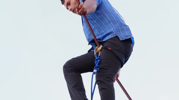 Highline athlete balancing on slack line tight rope