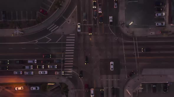 AERIAL: Birds Eye View of Culver City, Los Angeles, California Traffic, Intersection at Dusk with