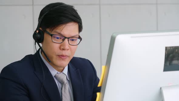 Business People Wearing Headset Working in Office