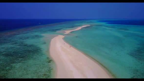 Aerial drone texture of luxury coastline beach voyage by turquoise ocean with white sandy background