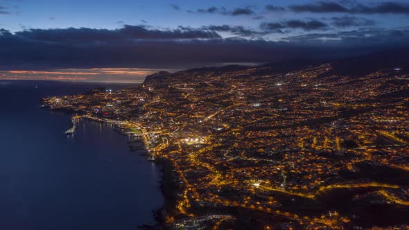 Drone Shot of Illuminated Funchal City at Night Madeira Island Portugal