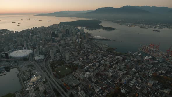 Aerial wide shot of Vancouver Eastside and docks, Dusk