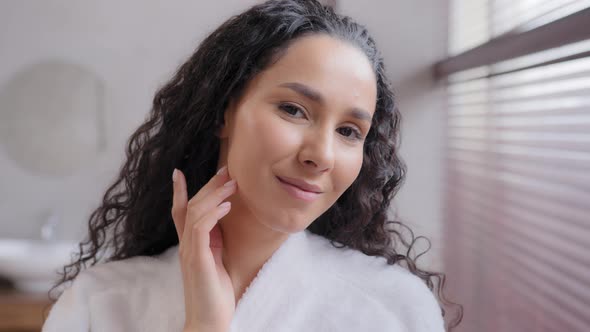 Headshot Young Happy Attractive Young Curly Woman in Bathrobe in Bathroom Touching Soft Smooth
