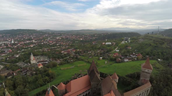 Aerial view of Hunedoara city and Corvin Castle
