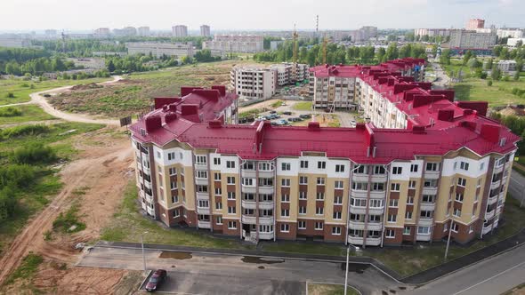 Modern Apartment Building with a Red Roof Aerial View