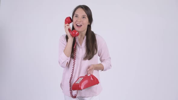 Young Happy Multi-ethnic Businesswoman Talking on Telephone