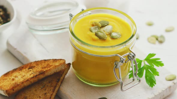 Pumpkin Soup in Glass Jar with Bread